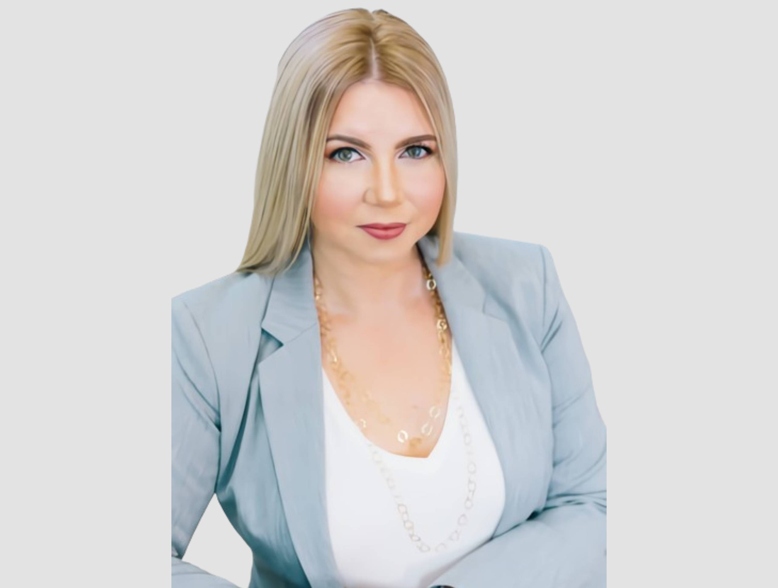 Cara L. Powell, A professional woman wearing a blue blazer and white shirt, exuding confidence and elegance.